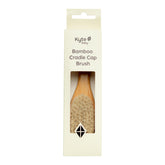 Kyte Baby cradle cap brush with goat hair bristles for gentle scalp massage.