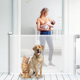 KYXAIN retractable baby gate at stairs, 33-inch tall, versatile protection.