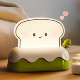 L LOHAS LED cute toaster night light creates warm bedside ambience.