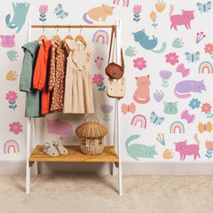 Ladinimo cat wall decals featuring butterflies for a playful bedroom.