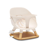 Lalo booster seat Grapefruit, front view with secure harness for at-table seating