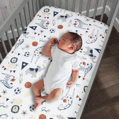 Lambs & Ivy closeup of custom animals playing sports design on crib sheet