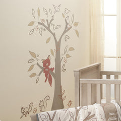 Lambs and Ivy beige tree decal with treetop design for a calm forest vibe.
