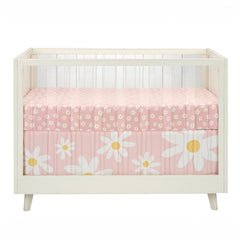 Lambs & Ivy Daisy Dreams machine-washable sheet simplifies nursery laundry.
