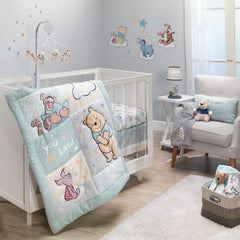 Lambs & Ivy Winnie the Pooh Hugs quilt with Pooh applique for soft, cozy nursery time