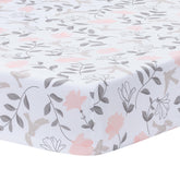 Lambs & Ivy Petals crib sheet pattern with soft floral design for nursery charm.