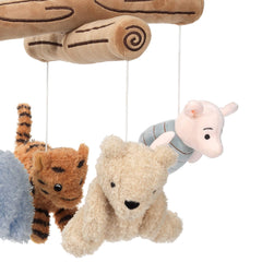 Pooh plush characters on Lambs & Ivy mobile rotating to hold baby’s attention