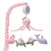 Lambs & Ivy Sea Dreams mobile with dolphins and turtles for soothing motion.
