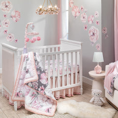Lambs & Ivy Signature Botanical Minky changing pad cover includes button holes for safety straps during diaper changes.