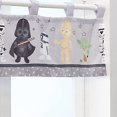 Lambs & Ivy Star Wars valance featuring R2-D2 brightens the space.