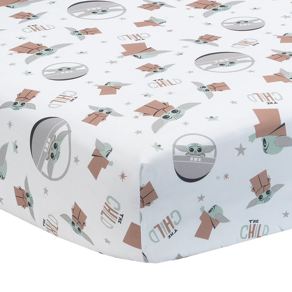 Lambs & Ivy Star Wars The Child crib sheet shows Baby Yoda in poses for cozy sleep