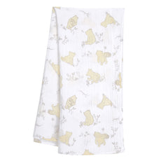 Lambs and Ivy Winnie the Pooh swaddle fabric close up shows breathable muslin texture.