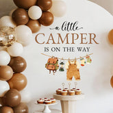 LANKBACK A Little Camper Is On The Way decal used as a baby shower backdrop.