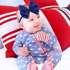 Lanmerry blue headband bow adds playful patriotic flair to photos.