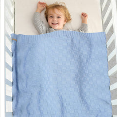 LAWKUL Checkered Knit Blanket full view highlights timeless pattern and nursery compatibility.