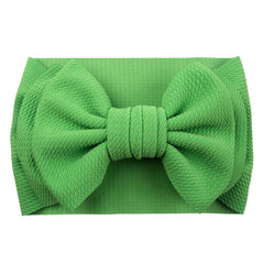 LDDCX baby bows headband elastic band, side view, easy wear for active days.