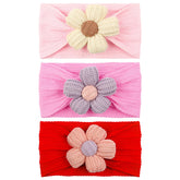 LemonSpace baby headband with big sunflower for stylish newborn outfits.