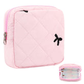 Lesmore period bag with pink bow for discreet on-the-go storage.
