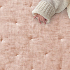 Levtex Baby pink textured muslin fitted sheet providing snug mattress fit.