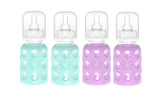Lifefactory glass baby bottle with mint silicone sleeve for easy gripping and feeding.