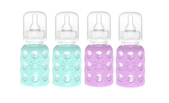 Lifefactory glass baby bottle with mint silicone sleeve for easy gripping and feeding.