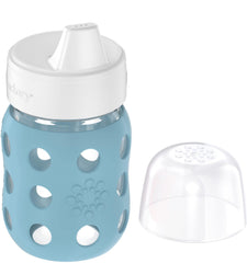 Hard sippy spout with vented valve for controlled flow