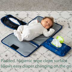 Lil Fox changing pad open, showcasing the cushioned surface for baby comfort.