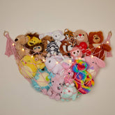 Lilly's Love macrame hammock on pink wall stores plush toys