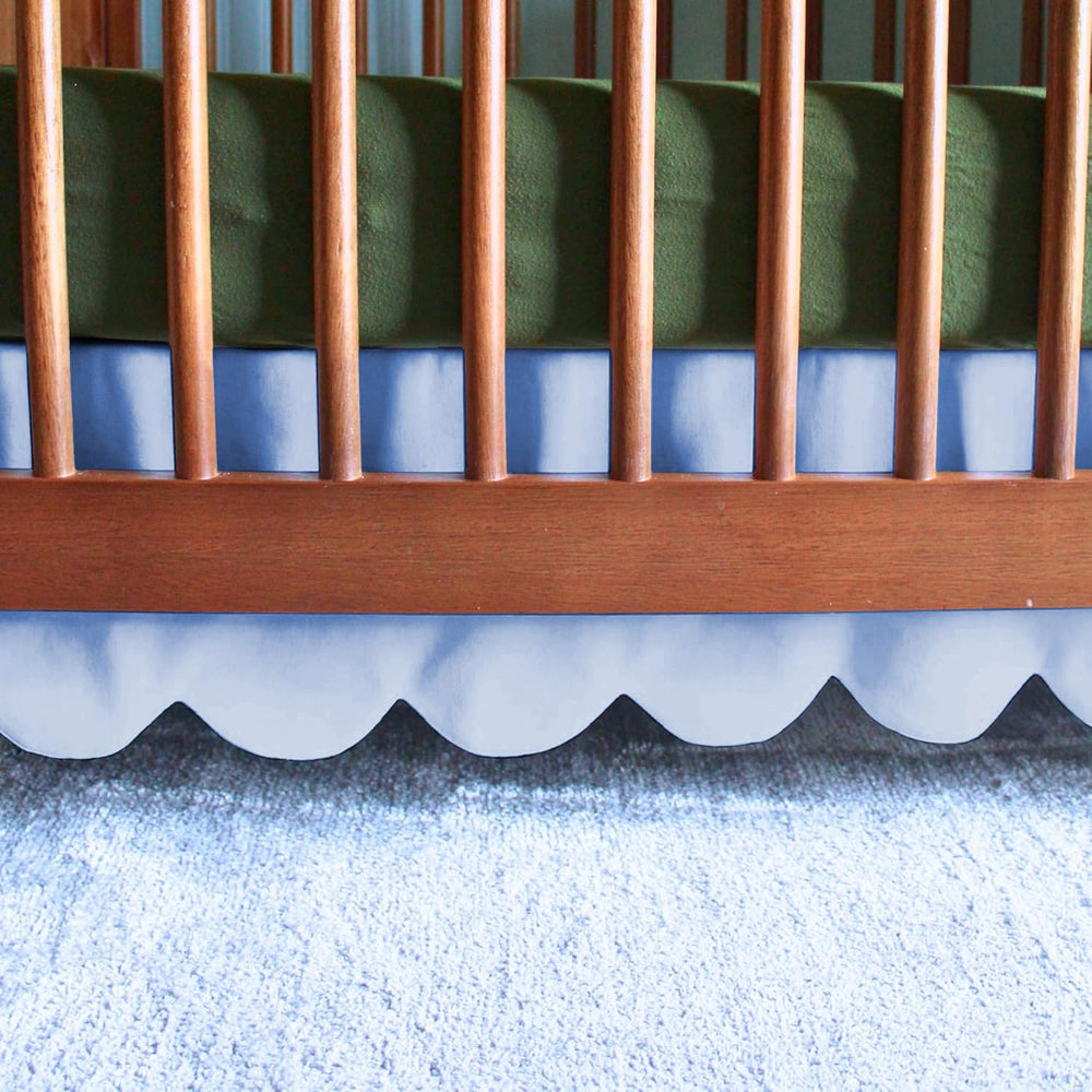 Linens Limited scalloped mini crib skirt 24x38, front view; creates soft nursery ambiance.