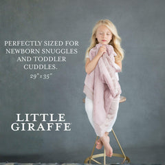Little Giraffe Luxe blanket on a stroller, lightweight and comfortable for outings.