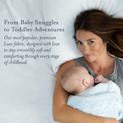 Little Giraffe Luxe blanket in stroller scene demonstrates lightweight comfort on the go.