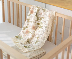 Little Jump boho nursery decor blanket complements crib setups.