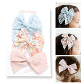 Little Poppy Co Hannah Set bows on a reversible clip for versatile styles.