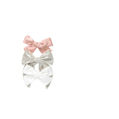 Little Poppy Co three bows in mustard mauve chambray add warm, versatile detail to outfits.