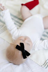 Little Poppy Co nylon headband closeup showing soft stretch and premium fabrics.