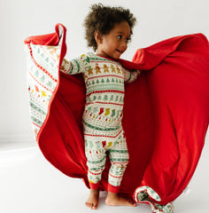 Little Sleepies Christmas blanket ready for tree lighting and bedtime stories.