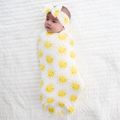 Little Sleepies Lunaluxe swaddle in sunshine print for stroller shade.