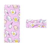 Little Sleepies swaddle set with bow in Pink Breakfast Buddies for cozy newborn comfort
