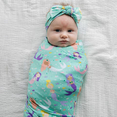 Mermaid Magic swaddle used as stroller shade and gentle burp cloth during outings