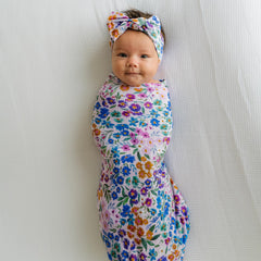 Baby wearing Luxe Bow Headband Sweet Pea for gentle, growing-fit styling