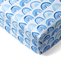 Little Sleepies viscose bamboo crib sheets in blue rainbows offer ultra-soft comfort.