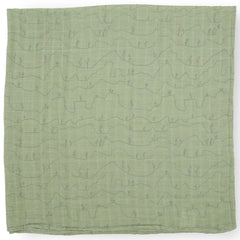 Little Unicorn Cactus Lines swaddle used for nursing and soothing moments