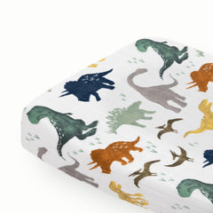 Little Unicorn Dino Friends changing pad cover in soft muslin for gentle diaper changes