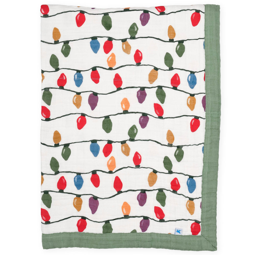 Little Unicorn Christmas bulbs quilt with four-layer cotton muslin for cozy naps.