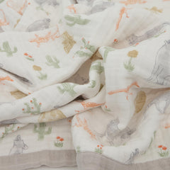 Little Unicorn Desert Night quilt used as on-the-go play surface and tummy-time companion.