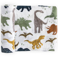 Little Unicorn dino friends swaddle blanket closeup shows soft breathable fabric for gentle swaddling.