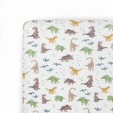 Little Unicorn Dino Pals crib sheet close-up, ultra-soft rayon knit for cozy nights.