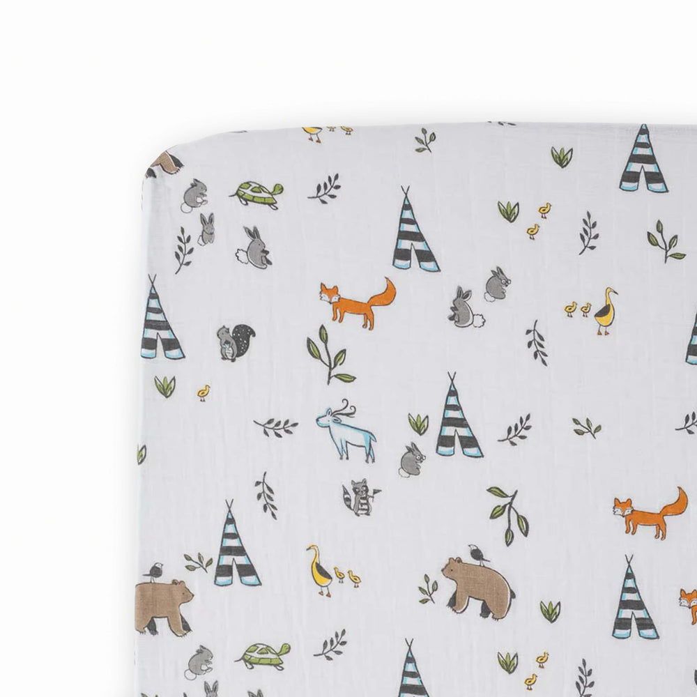 Little Unicorn Forest Friends crib sheet flatlay showcases breathable muslin softness