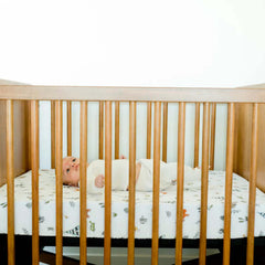 Forest Friends crib sheet styled in a nursery with coordinating decor