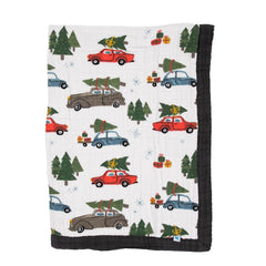 Little Unicorn four-layer muslin cuddle quilt offers soft warmth for newborn cuddles.